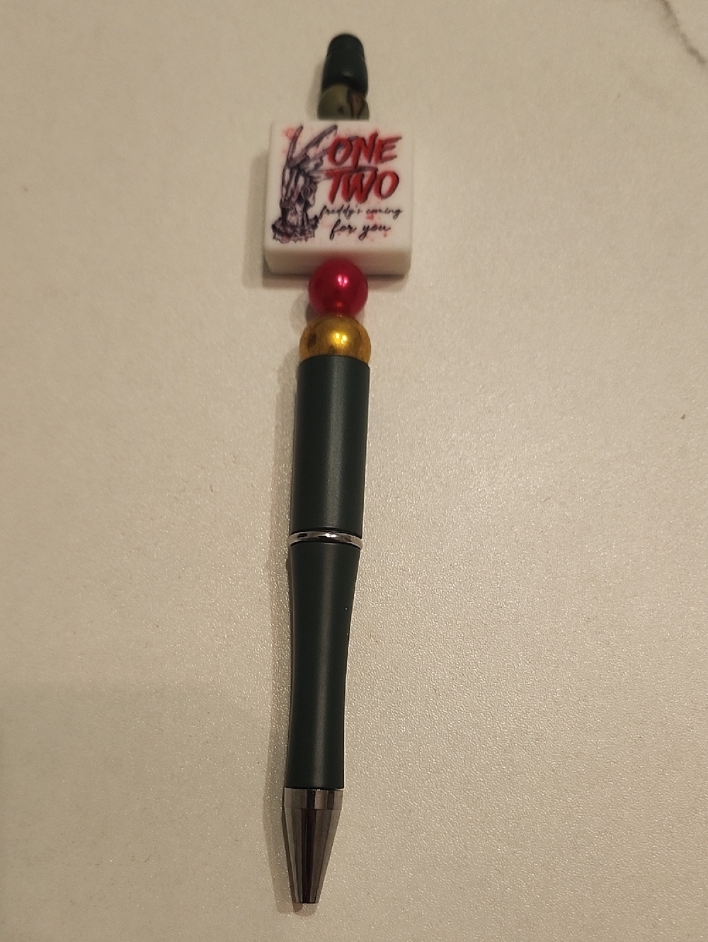 Hand Crafted Freddy Kreguer Pen with Red and Gold Accents